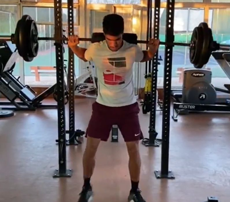 Carlos Alcaraz doing squats