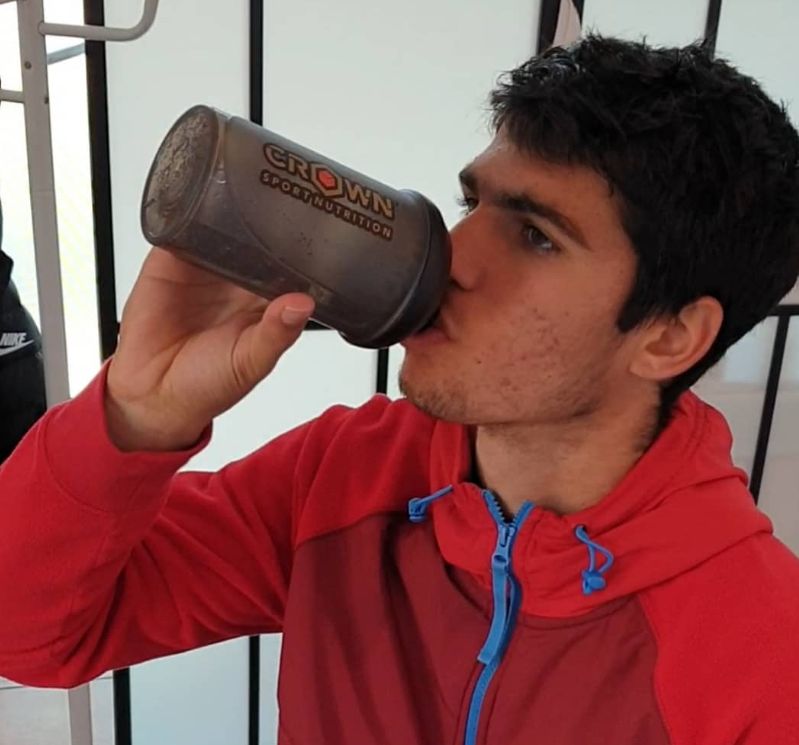 Carlos Alcaraz drinking a protein shake